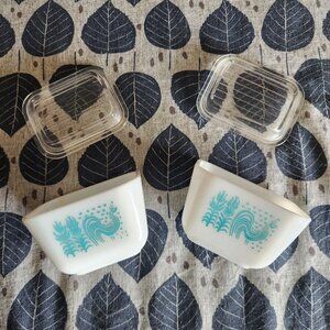 Pair of Pyrex dishes with lids, light blue rooster design